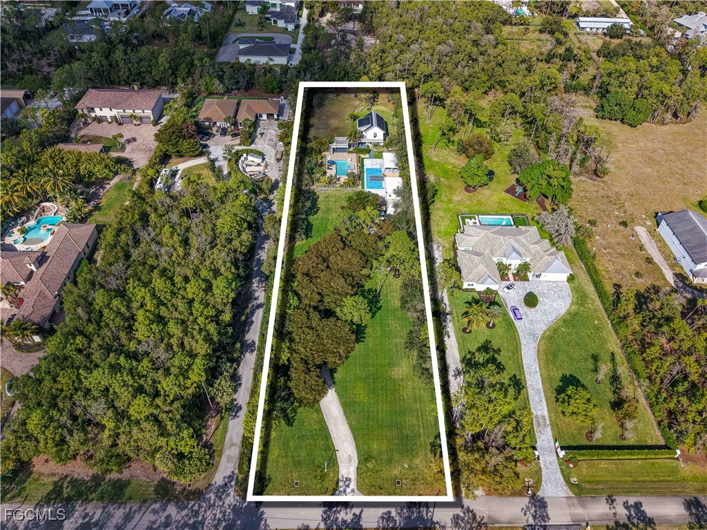 6941 Hunters Road Naples, FL 34109 - Photo 5 of 45 an aerial view of houses with yard