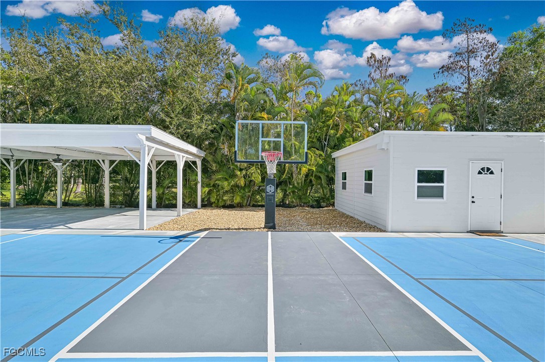 6941 Hunters Road Naples, FL 34109 - Photo 9 of 45 a house view with a garden space