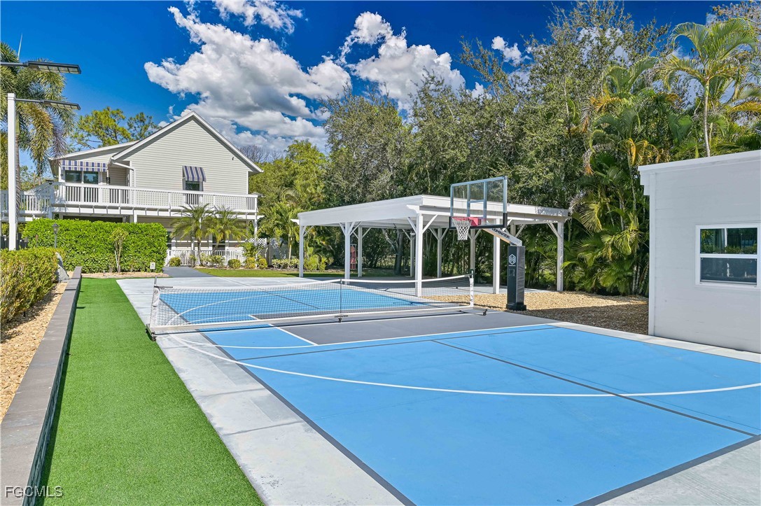 6941 Hunters Road Naples, FL 34109 - Photo 10 of 45 a front view of house with yard and green space