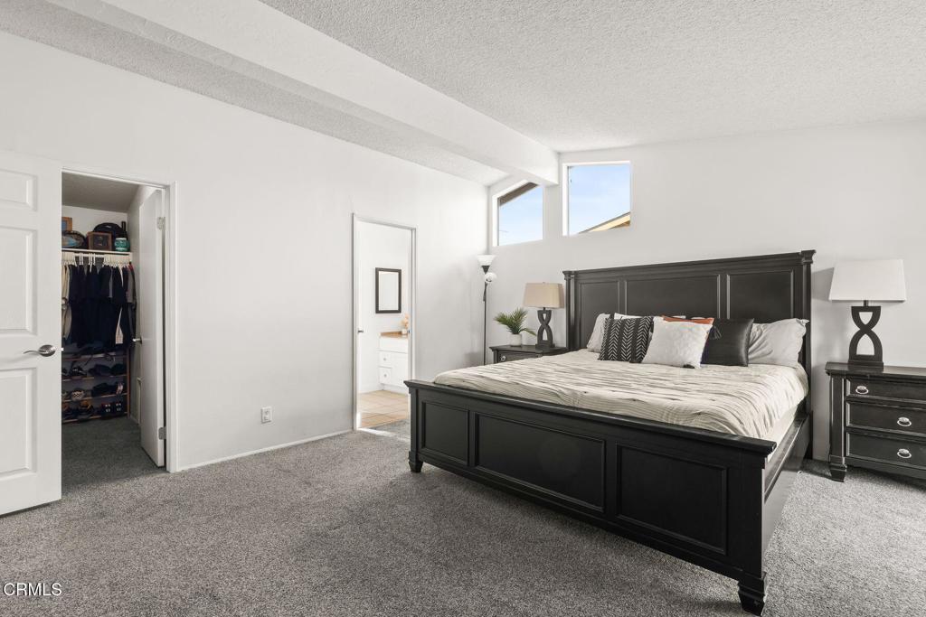 1025 Cachuma Avenue, Unit 59 Ventura, CA 93004 - Photo 11 of 36 a spacious bedroom with a bed and cabinets