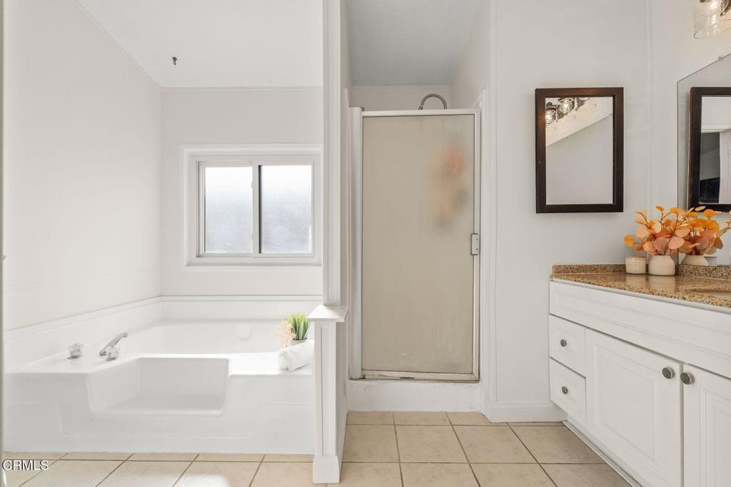 1025 Cachuma Avenue, Unit 59 Ventura, CA 93004 - Photo 12 of 36 a bathroom with a bathtub sink and mirror
