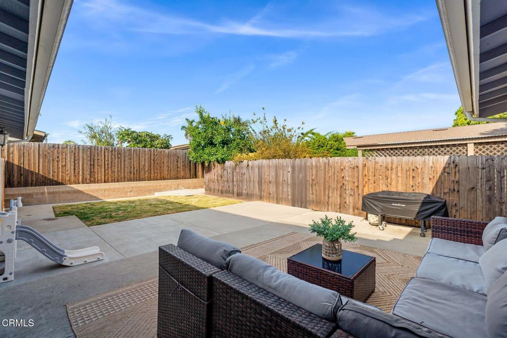 1025 Cachuma Avenue, Unit 59 Ventura, CA 93004 - Photo 17 of 36 a view of a chairs and table in the backyard