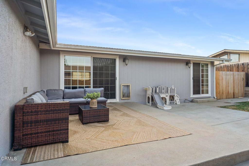 1025 Cachuma Avenue, Unit 59 Ventura, CA 93004 - Photo 22 of 36 a living room with furniture a window and a table