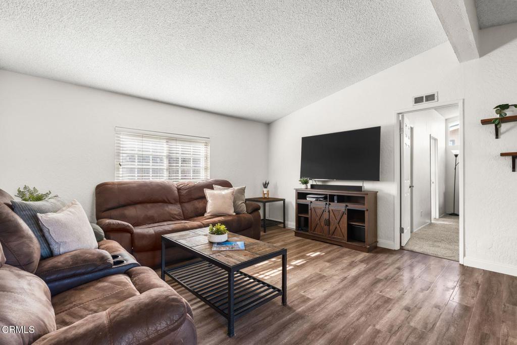 1025 Cachuma Avenue, Unit 59 Ventura, CA 93004 - Photo 23 of 36 a living room with furniture and a flat screen tv