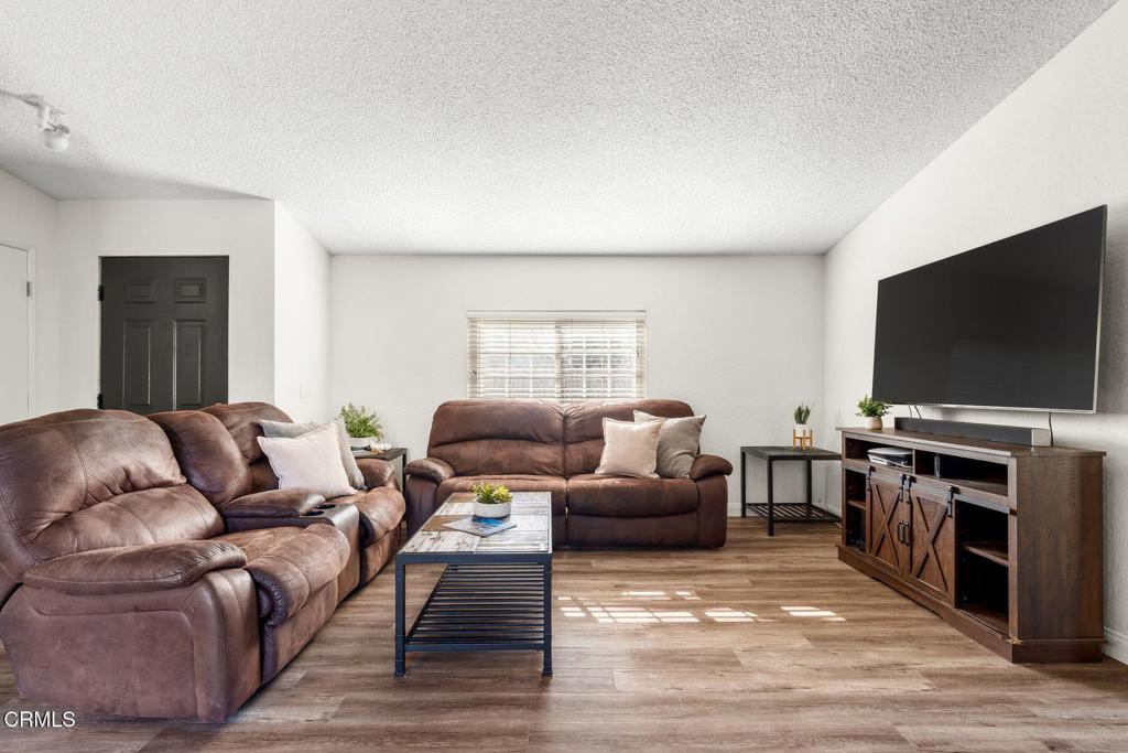 1025 Cachuma Avenue, Unit 59 Ventura, CA 93004 - Photo 3 of 36 a living room with furniture and a flat screen tv