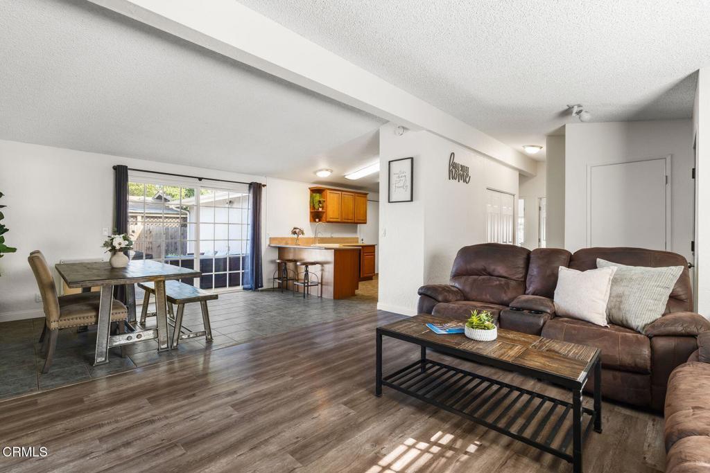 1025 Cachuma Avenue, Unit 59 Ventura, CA 93004 - Photo 4 of 36 a living room with furniture and a wooden floor