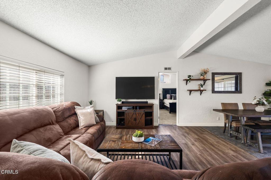 1025 Cachuma Avenue, Unit 59 Ventura, CA 93004 - Photo 9 of 36 a living room with furniture and a flat screen tv
