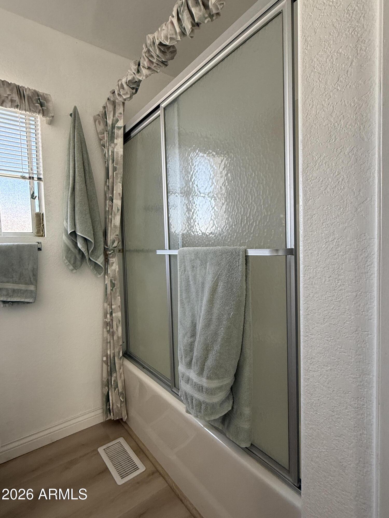 21340 Trading Post Trail Congress, AZ 85332 - Photo 16 of 31 a bathroom with a shower and a mirror