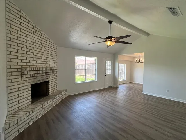 a view of livingroom with hardwood floor and a ceiling fan