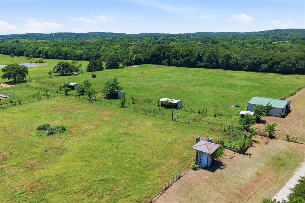 321 Cr 211 Road Gainesville, TX 76240 - Photo 36 of 40 View of loafing sheds and barn. This once usable announcers stand can be easily restored for all of your playdays!