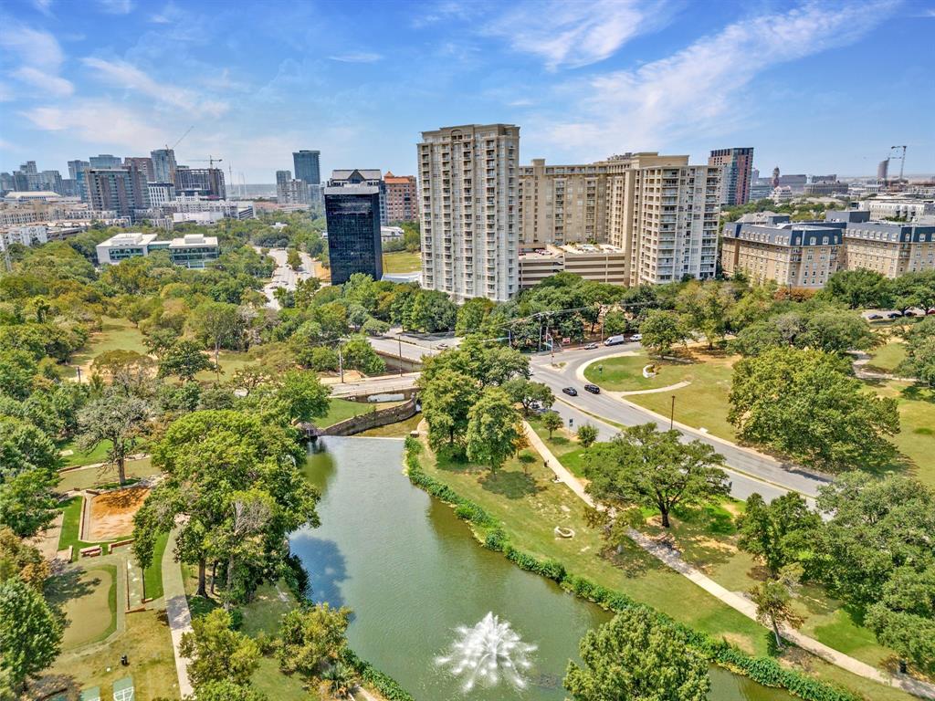 a view of a lake with a multi story building in front of it