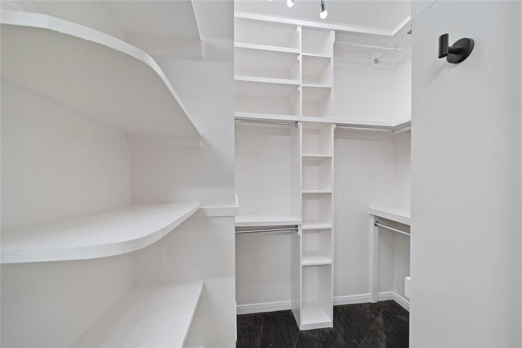 3225 Turtle Creek Boulevard, Unit 320 Dallas, TX 75219 - Photo 11 of 24 a view of walk in closet with empty racks
