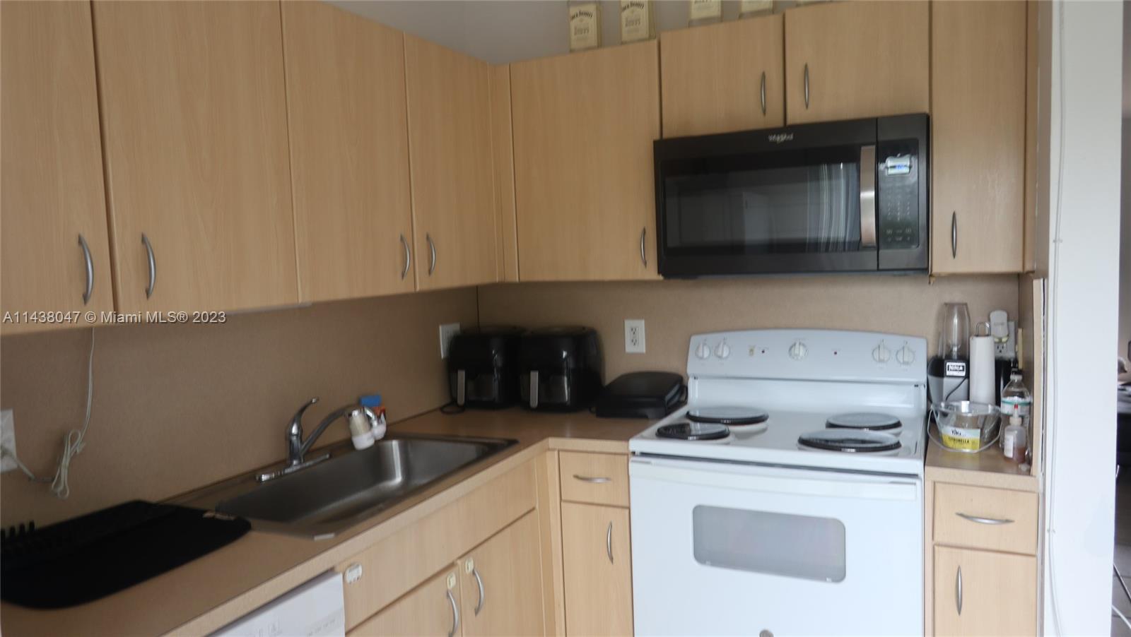 Kendall Miami, FL 33173 - Photo 8 of 9 a kitchen with a stove and a microwave