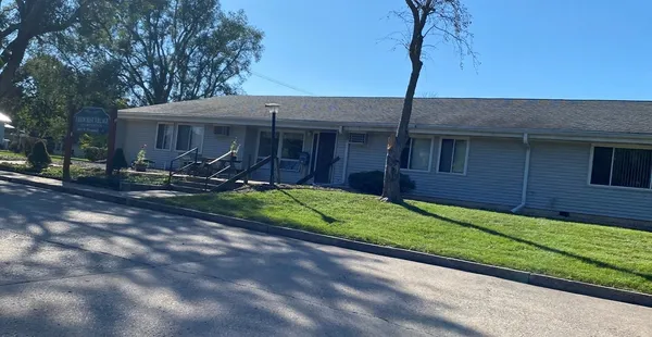 a view of a house with a yard