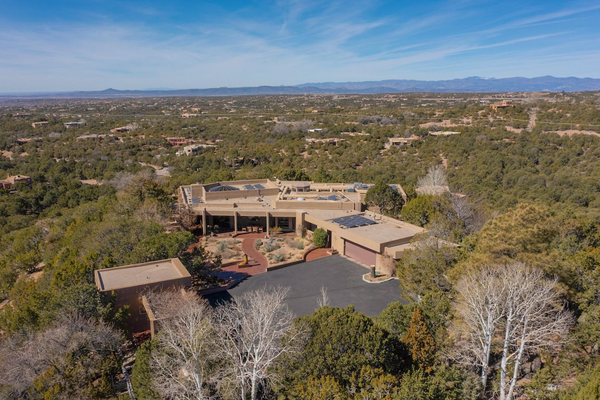 111 Barranca Road Santa Fe, NM 87501 - Photo 1 of 74 East facade and entry. RV garage on left