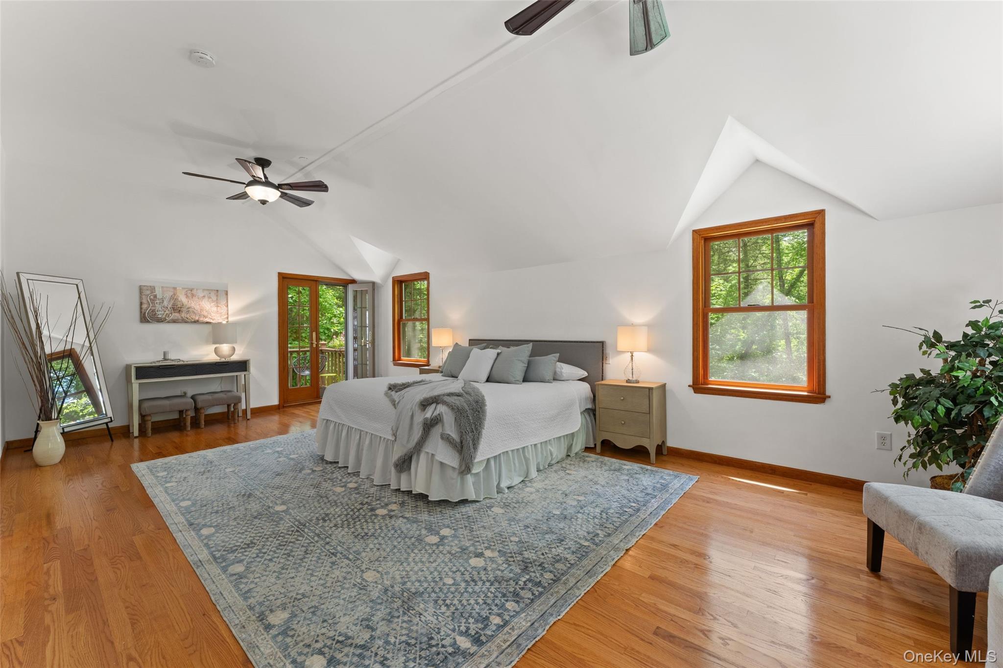 25 Cabin Ridge Road Chappaqua, NY 10514 - Photo 20 of 39 Room featuring wood-finish flooring, vaulted ceilings, and a ceiling fan
