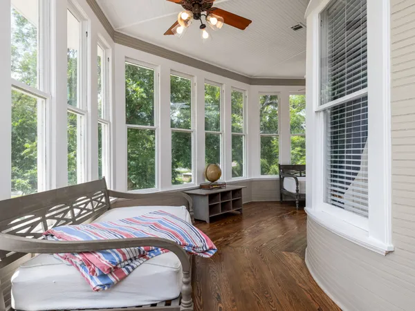 a room with furniture projector and screen