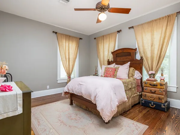 a bedroom with a bed and flat screen tv