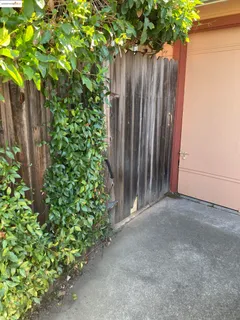a bedroom with a bed and a table chair