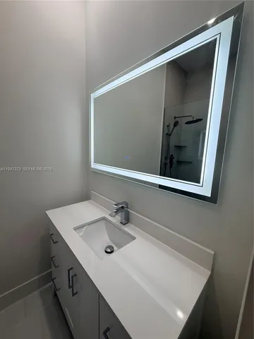 a view of an empty room with a fireplace