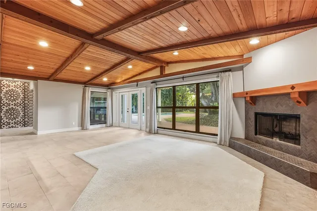 a view of an empty room with a fireplace