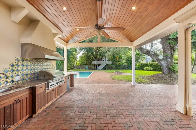a view of a kitchen with a sink and garden