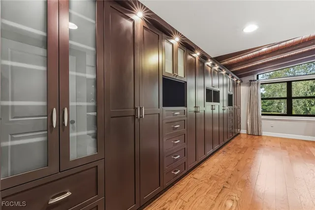 a open kitchen with refrigerator and window