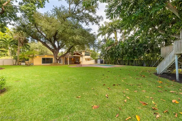 a house view with swimming pool