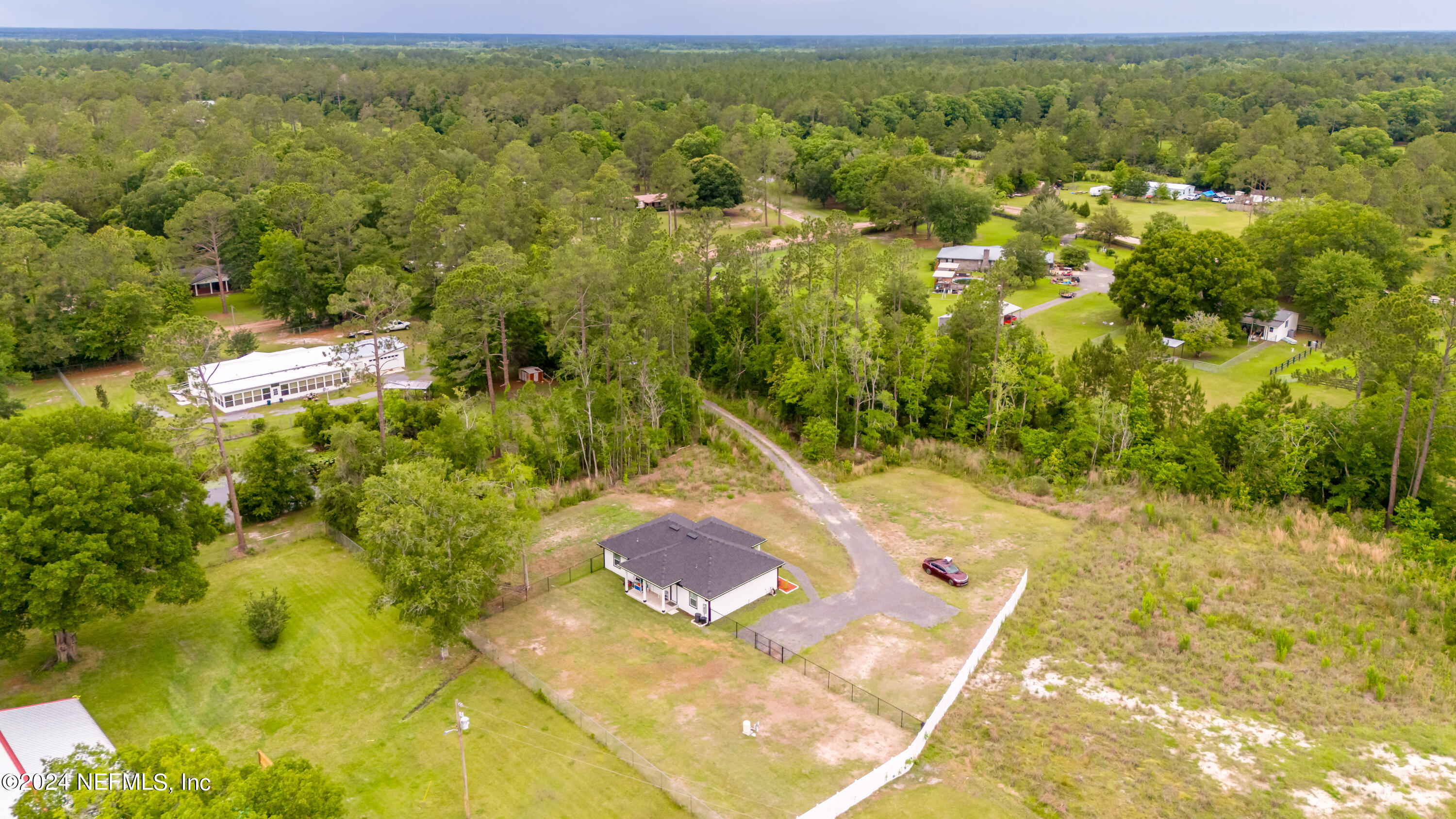 6477 Keith Griffis Circle Macclenny, FL 32063 - Photo 1 of 30 a view of a big yard with swimming pool