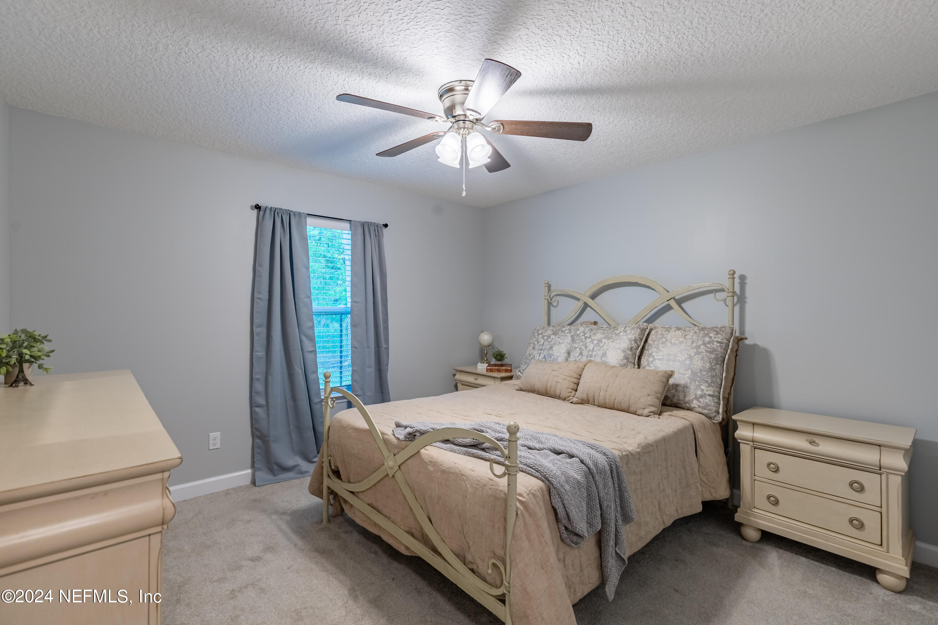 6477 Keith Griffis Circle Macclenny, FL 32063 - Photo 29 of 30 a bedroom with a bed and a dresser