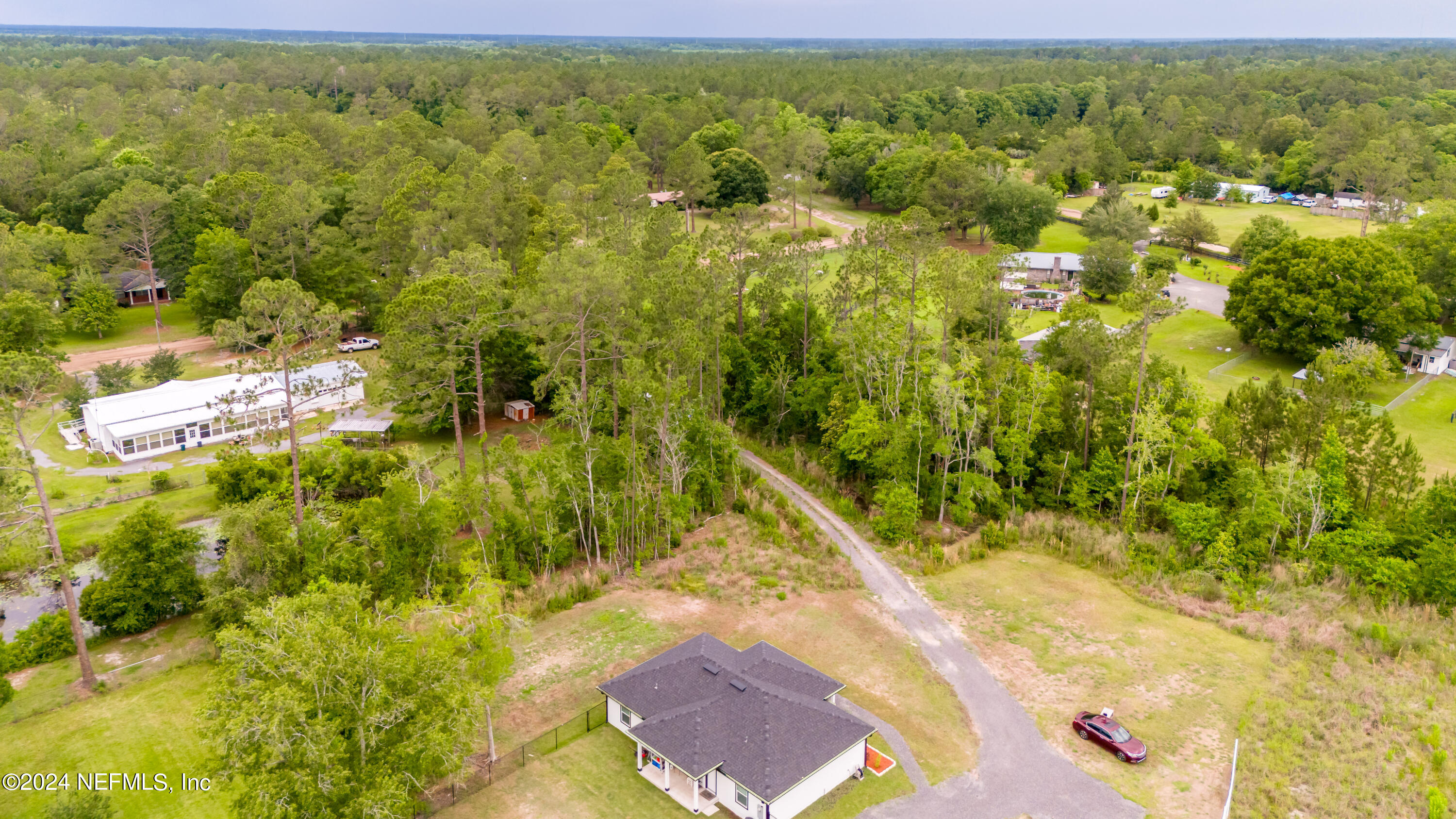 6477 Keith Griffis Circle Macclenny, FL 32063 - Photo 5 of 30 a view of a yard with an outdoor space