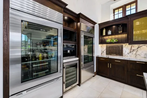 a bathroom with a glass shower door and a sink