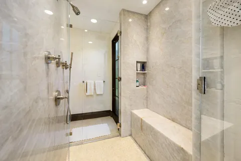 a view of a chairs and table in patio with a yard