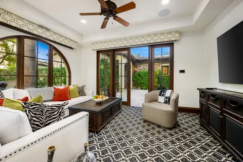 a front view of a house with a yard table and chairs