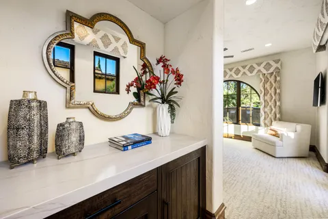 a living room with stainless steel appliances kitchen island granite countertop a dining table and chairs