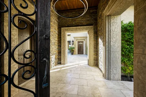 a view of a entryway door with wooden floor