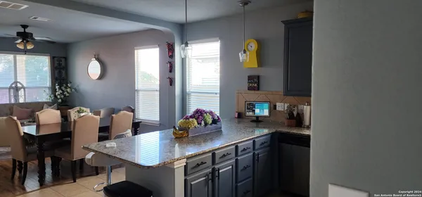 a kitchen with a sink cabinets and window