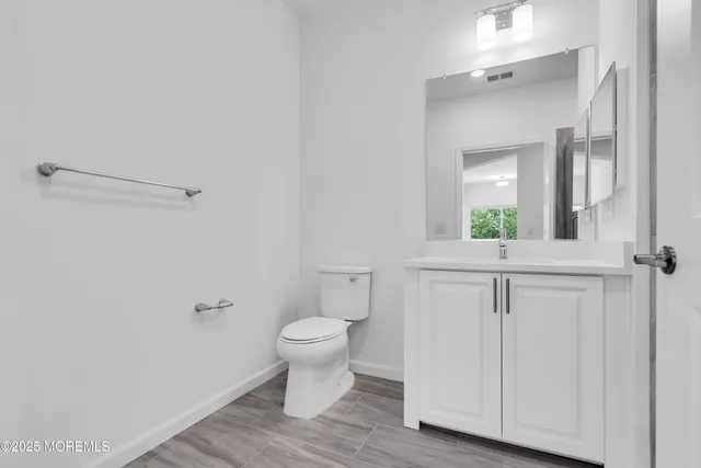 a view of a patio with table and chairs and potted plants