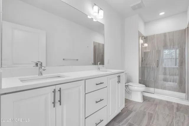 a front view of the house with a garden