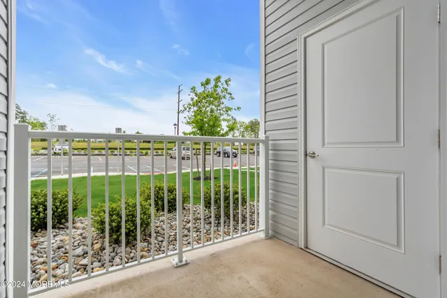 a view of livingroom with furniture and a potted plant