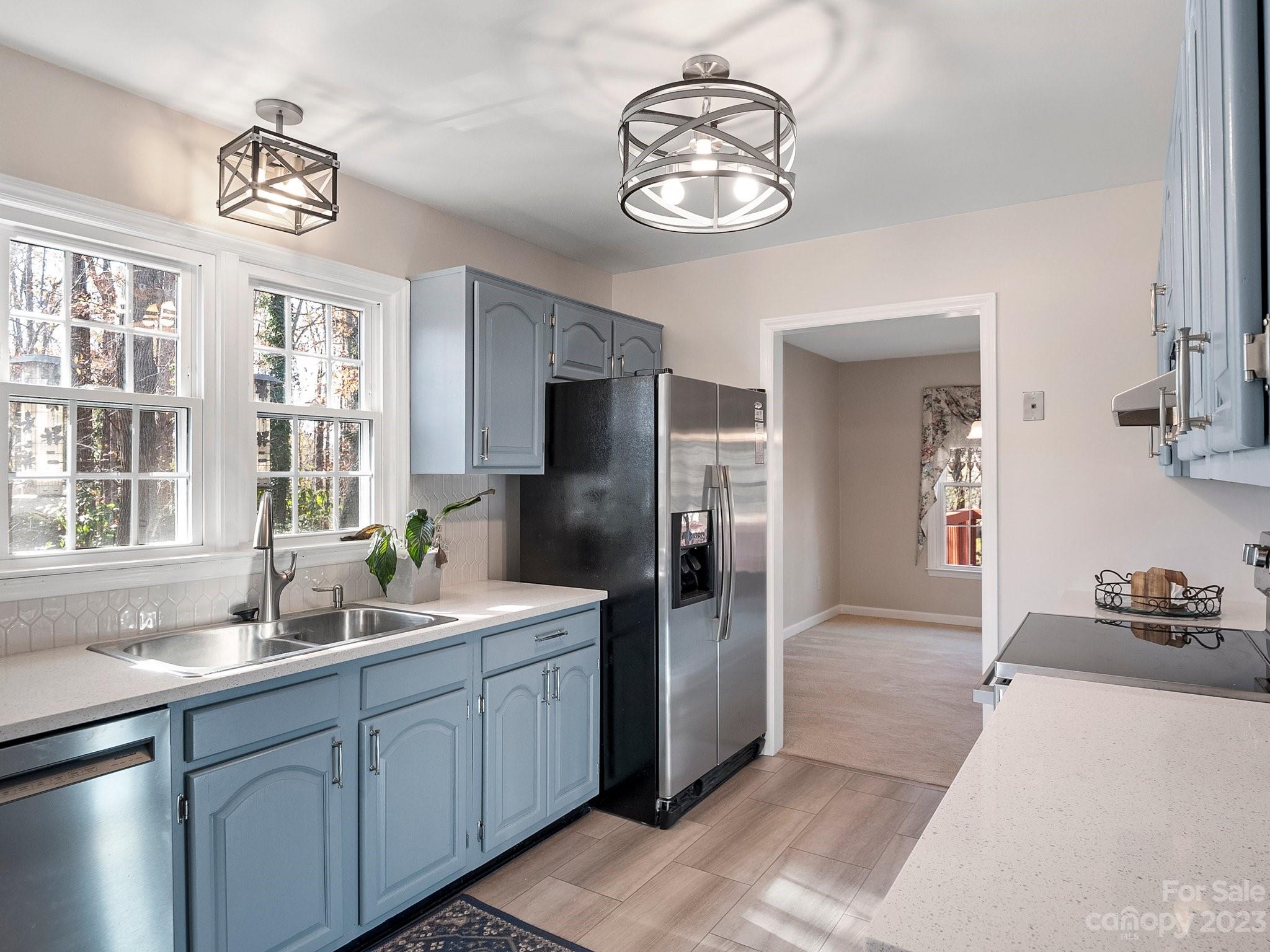 8211 Plott Road Charlotte, NC 28215 - Photo 18 of 38 a spacious bathroom with a sink and a mirror