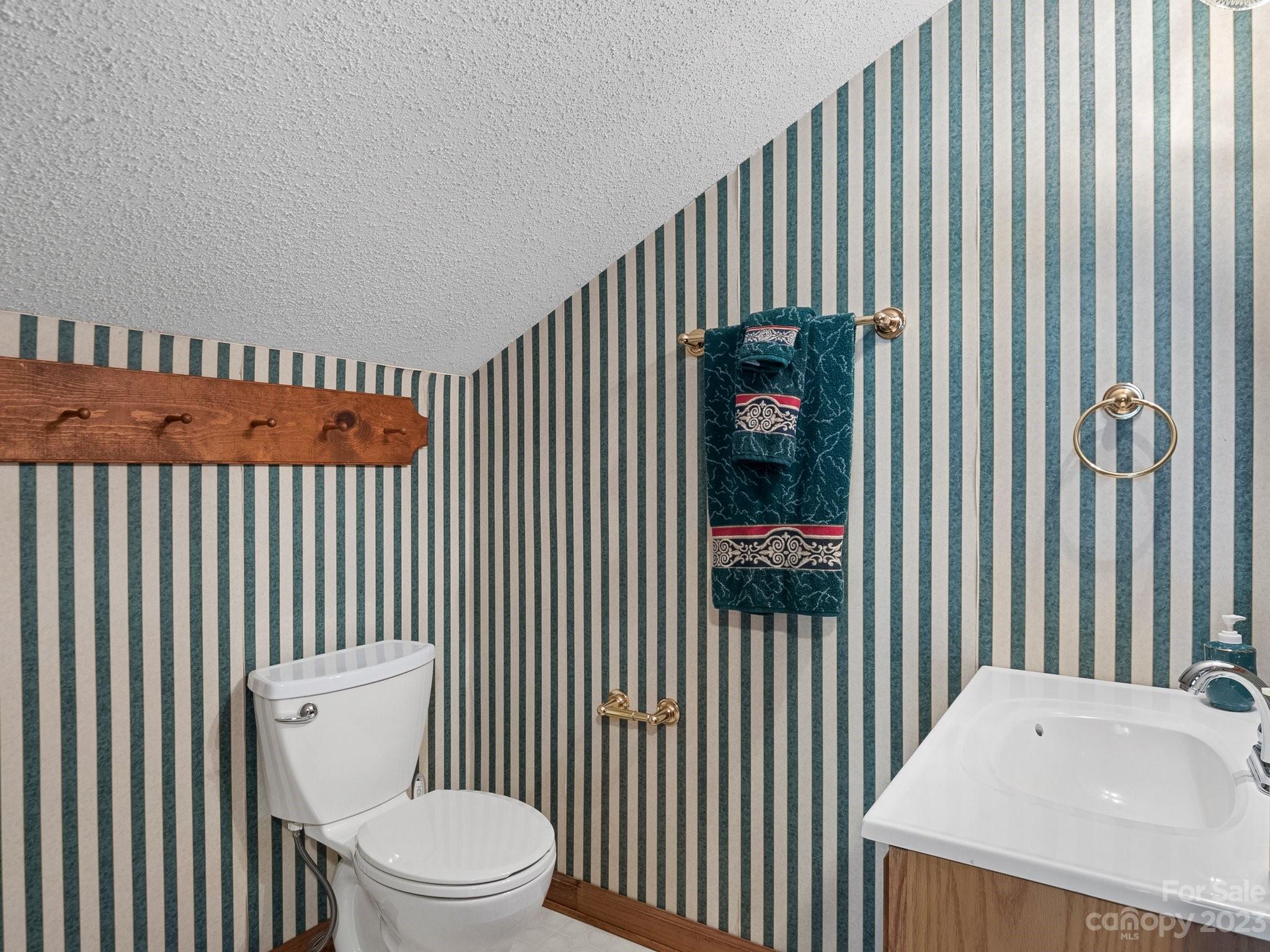 8211 Plott Road Charlotte, NC 28215 - Photo 28 of 38 a bathroom with a toilet and a sink