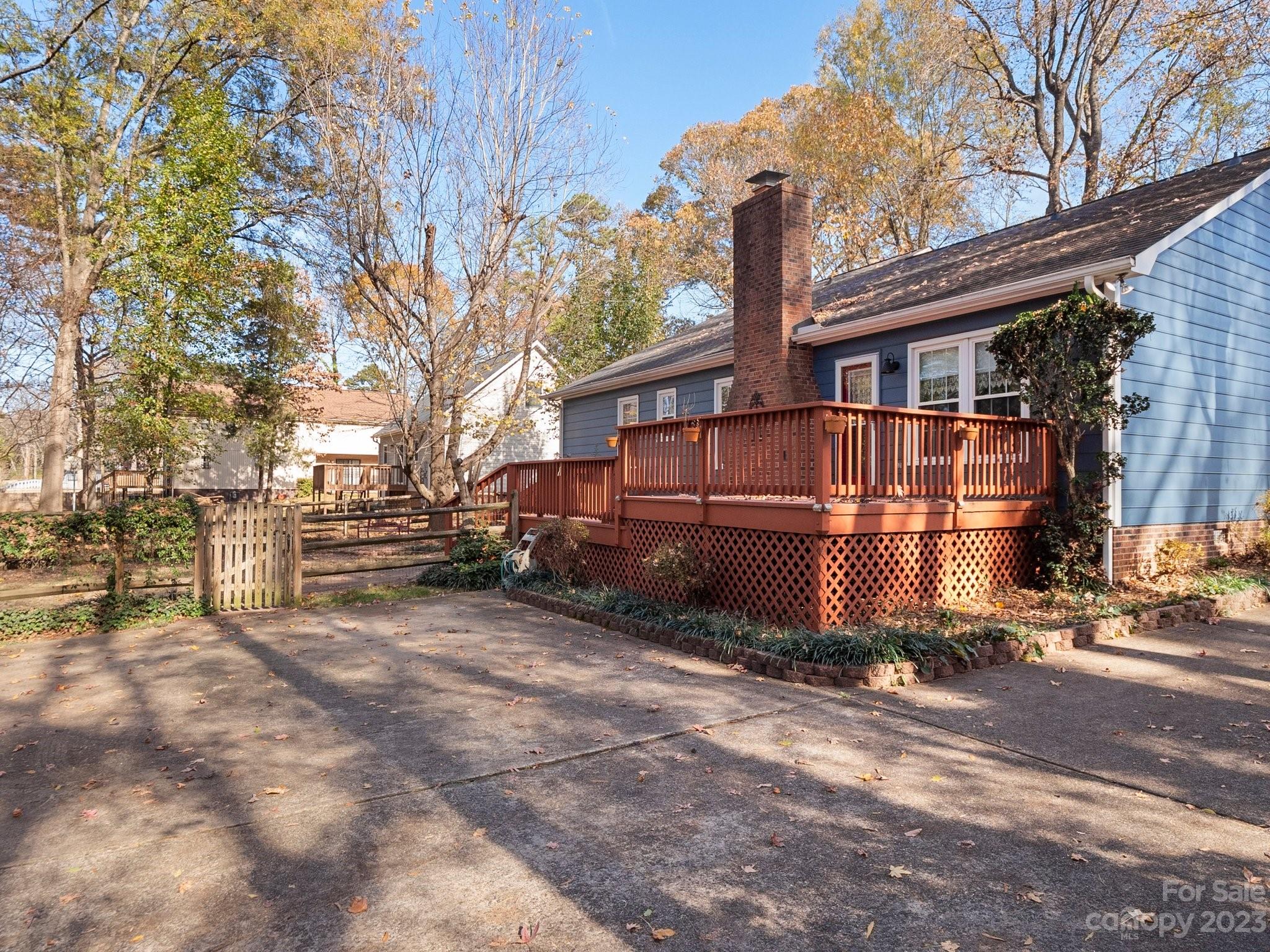 8211 Plott Road Charlotte, NC 28215 - Photo 29 of 38 a view of a house with a large tree in front of it