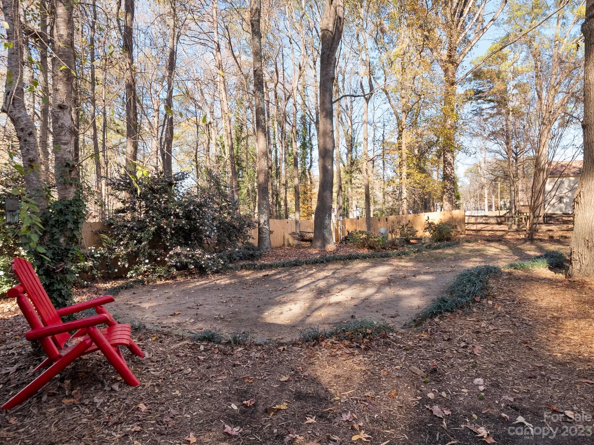 8211 Plott Road Charlotte, NC 28215 - Photo 37 of 38 a view of backyard with outdoor seating and trees