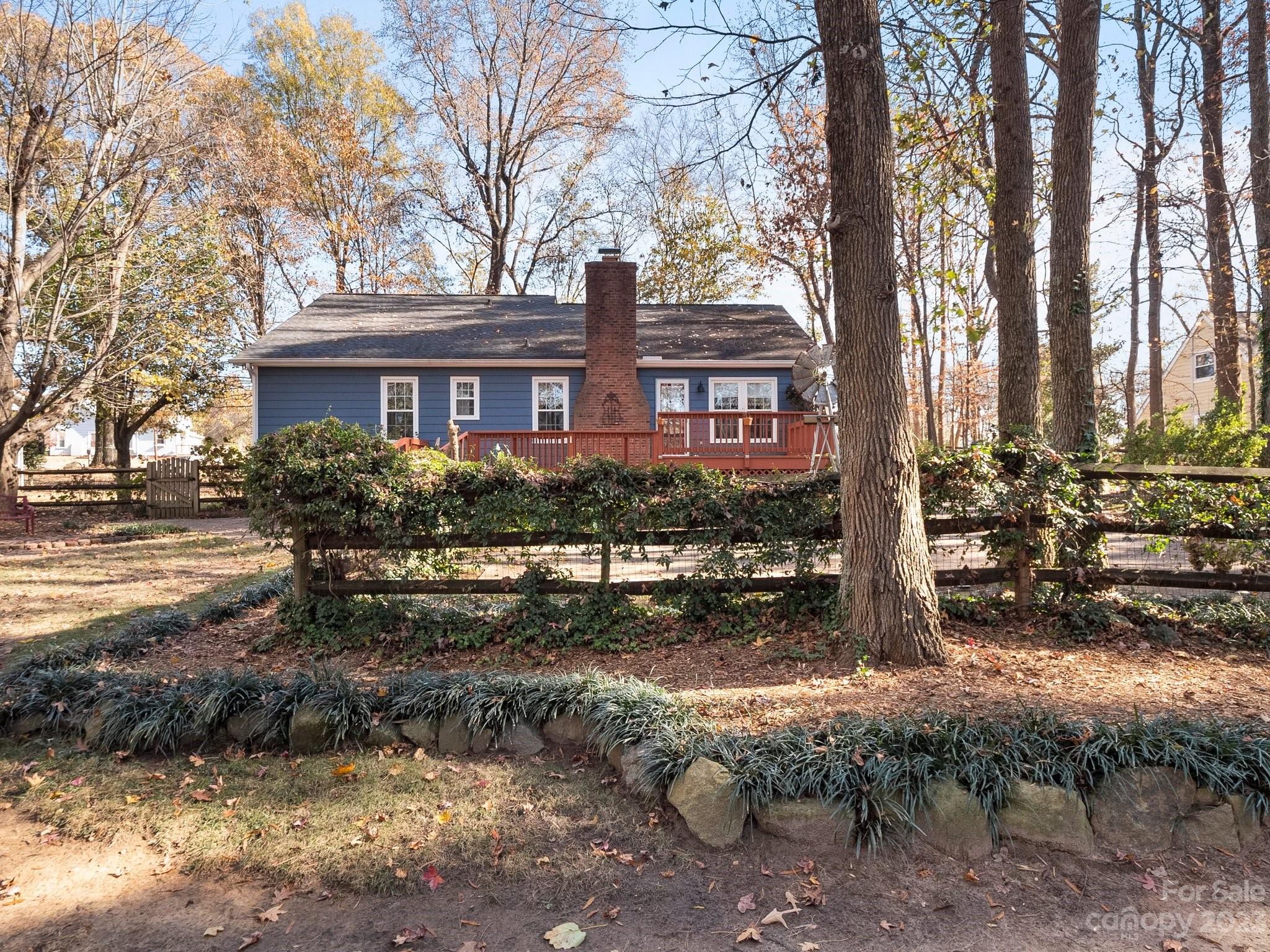 8211 Plott Road Charlotte, NC 28215 - Photo 38 of 38 a backyard of a house with lots of trees