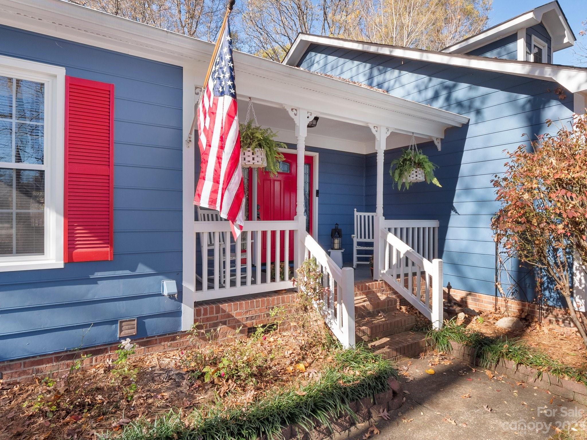 8211 Plott Road Charlotte, NC 28215 - Photo 5 of 38 a front view of a house with a yard
