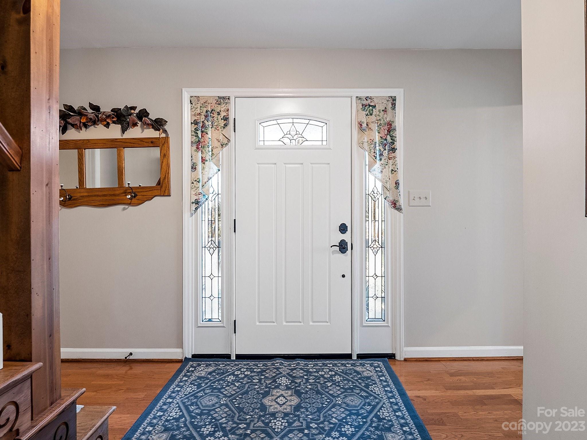 8211 Plott Road Charlotte, NC 28215 - Photo 7 of 38 a view of an entryway with wooden floor