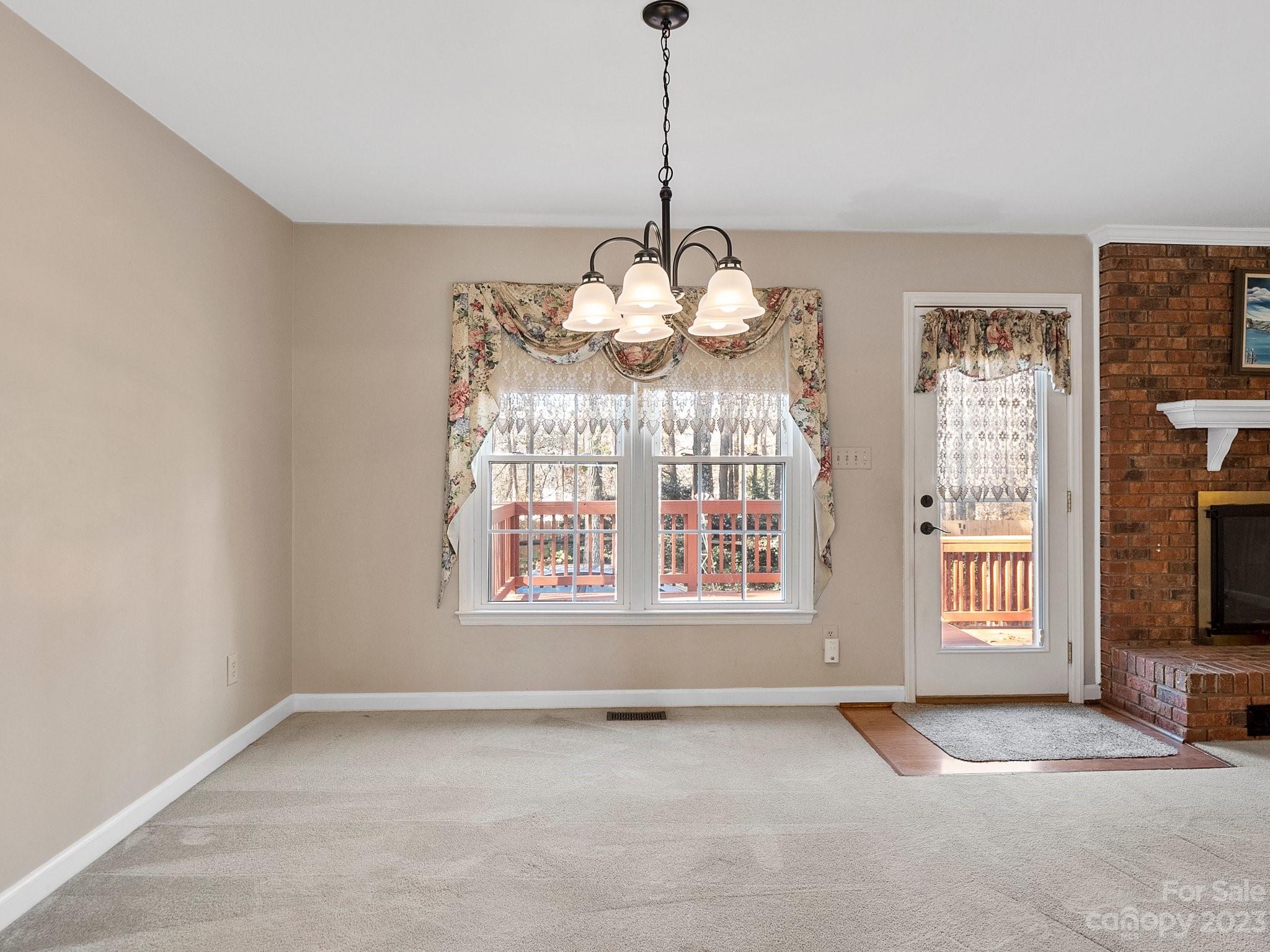 8211 Plott Road Charlotte, NC 28215 - Photo 9 of 38 a view of an empty room with a window