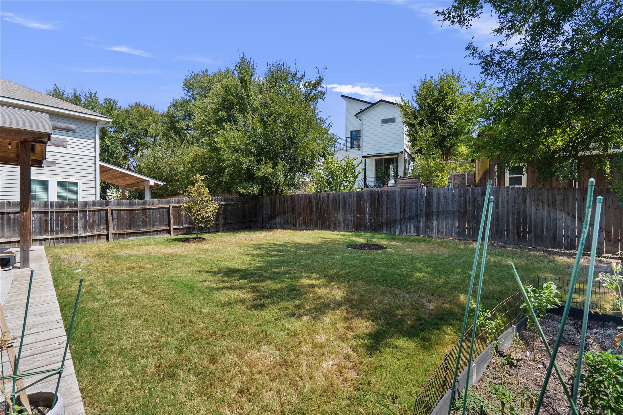 1309 Fort Branch Boulevard Austin, TX 78721 - Photo 18 of 19 a view of a backyard with plants and a patio