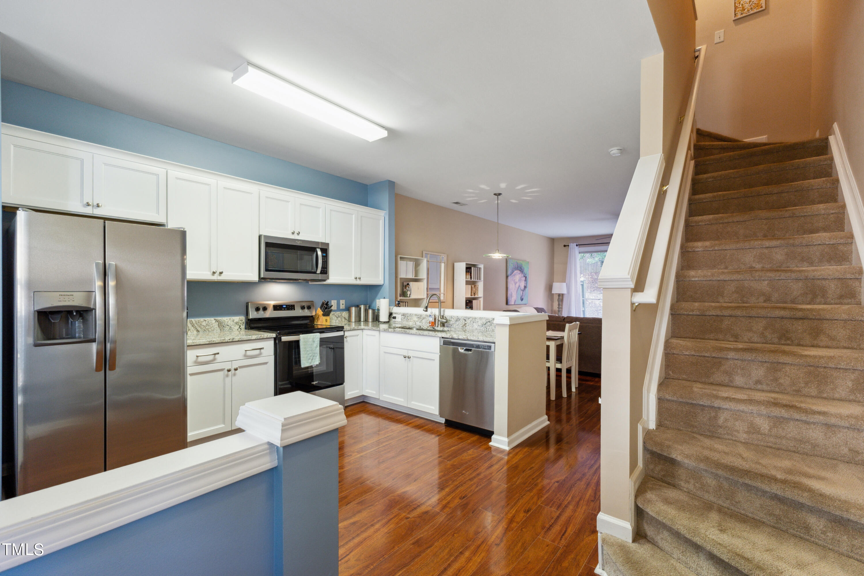 1824 Natalie Brook Way Raleigh, NC 27609 - Photo 13 of 28 a kitchen with a refrigerator microwave and stove top oven
